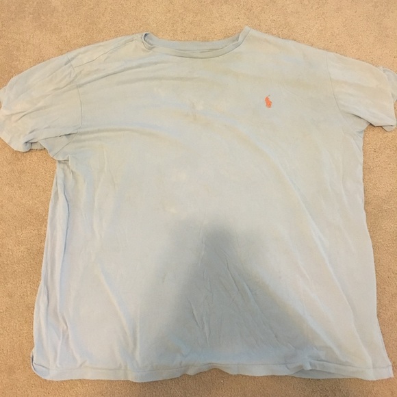 blue polo shirt with orange horse